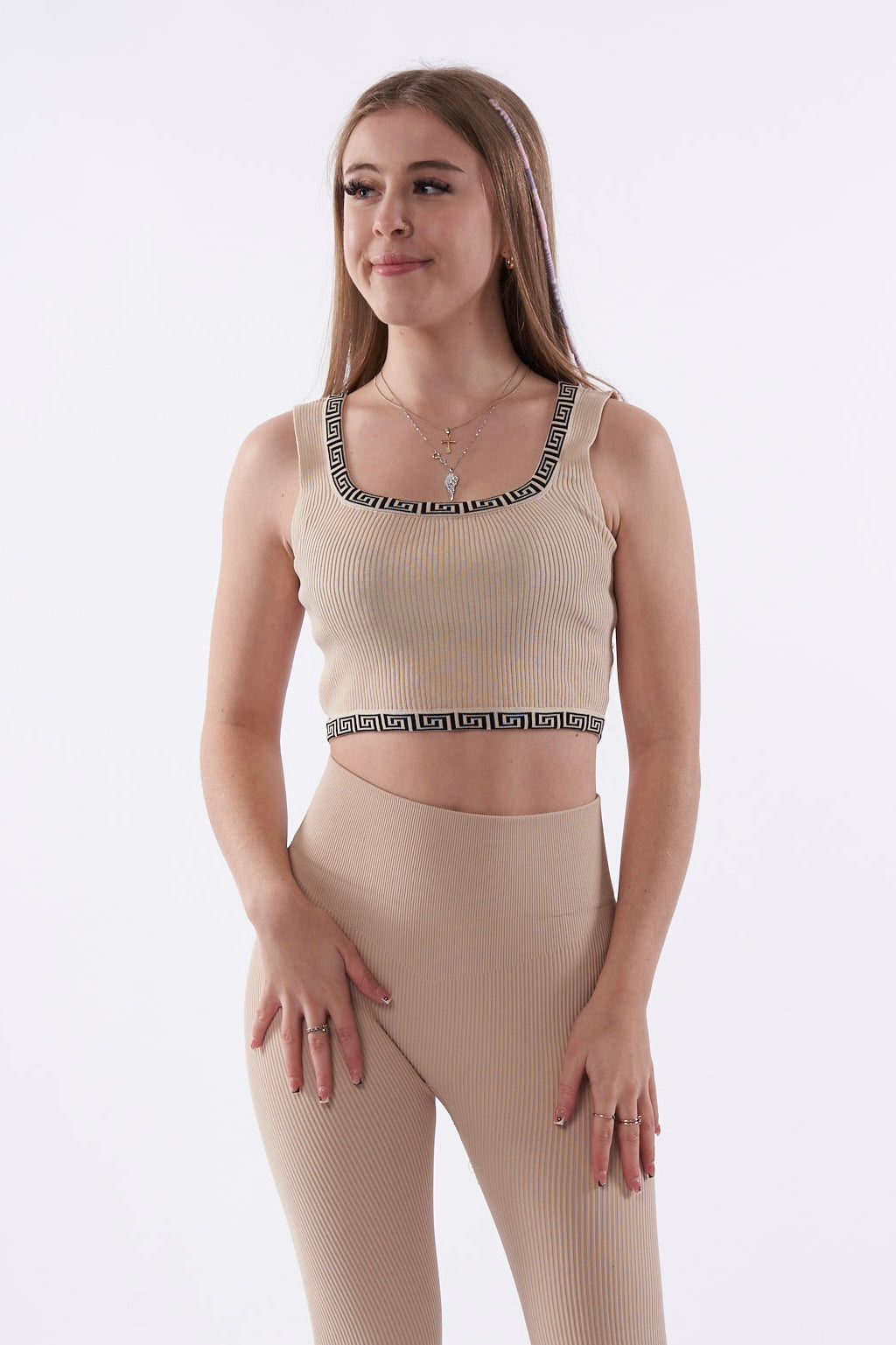 Beige ribbed crop top with black pattern trim
