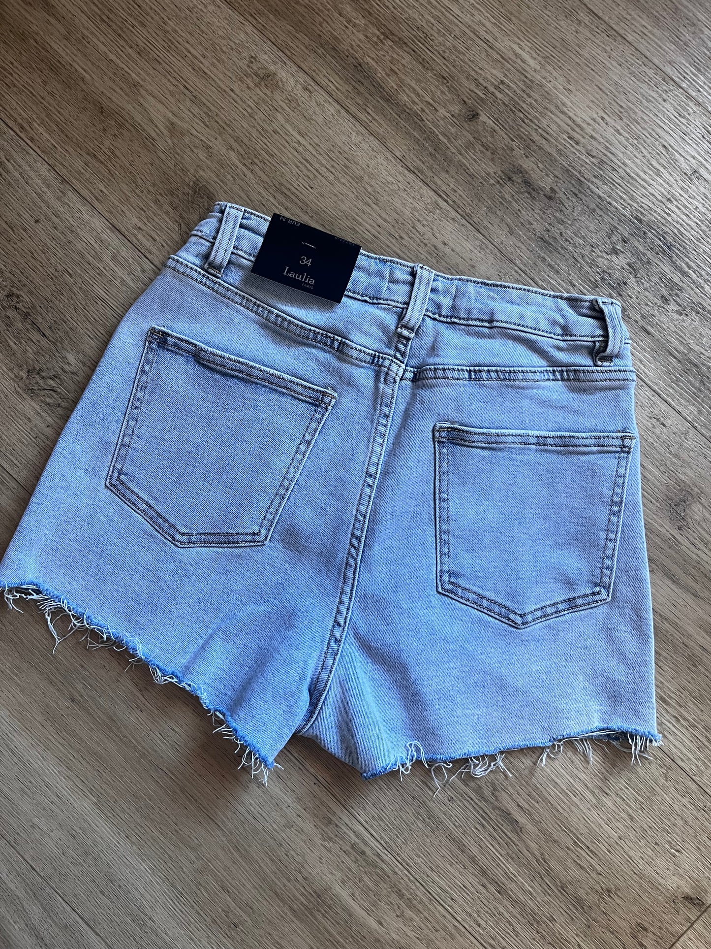 Stretchy light wash denim skort